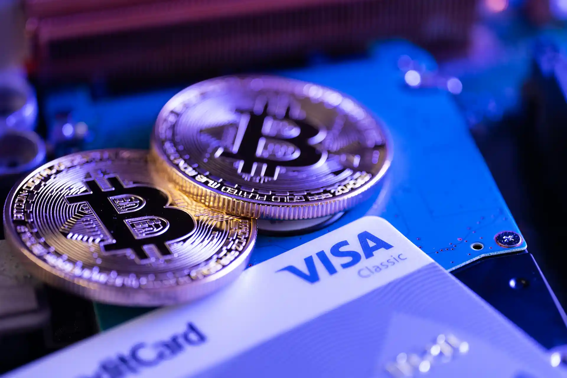 WHAT IS A CRYPTO CARD? — A person using a crypto payment card at a retail point-of-sale terminal for a transaction.